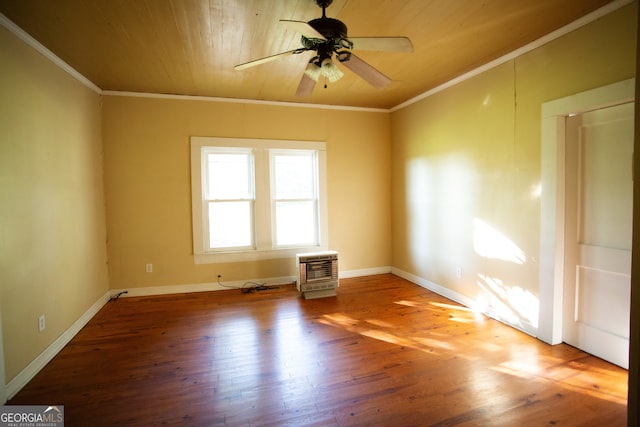 unfurnished room with hardwood / wood-style floors, crown molding, heating unit, and ceiling fan