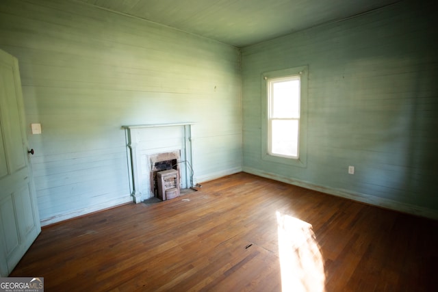 unfurnished living room featuring wood-type flooring