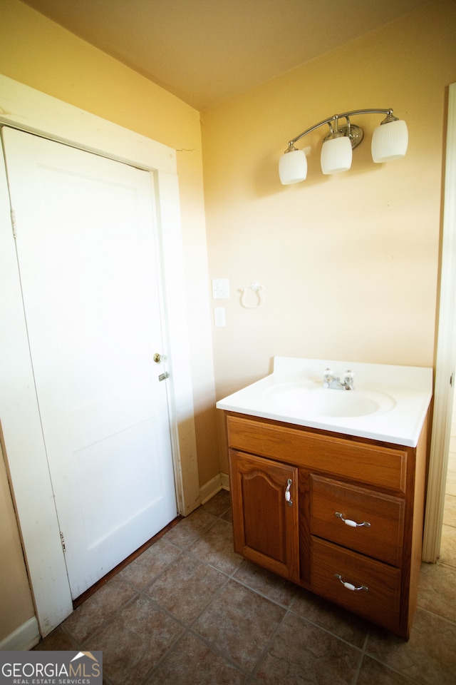 bathroom with vanity and tile patterned floors