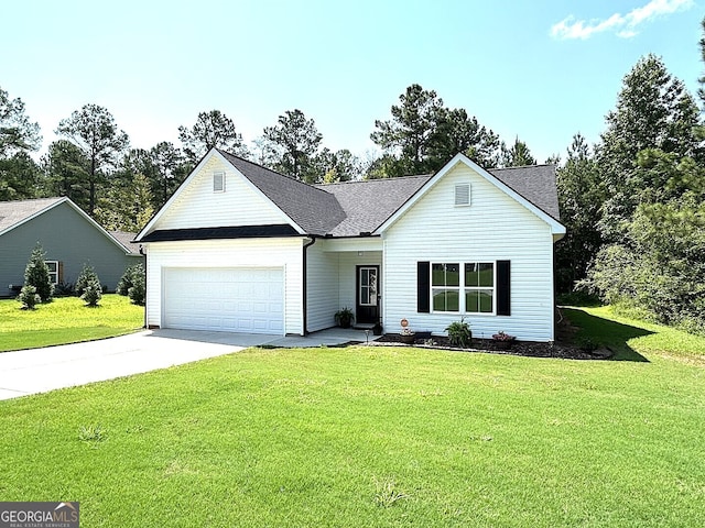 view of front of house featuring a garage and a front yard