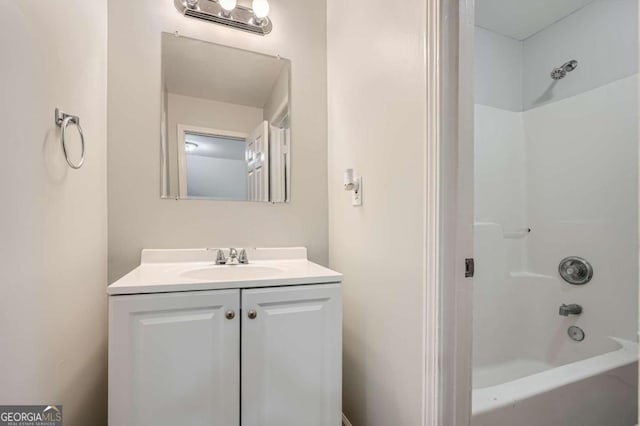 bathroom with vanity and shower / washtub combination