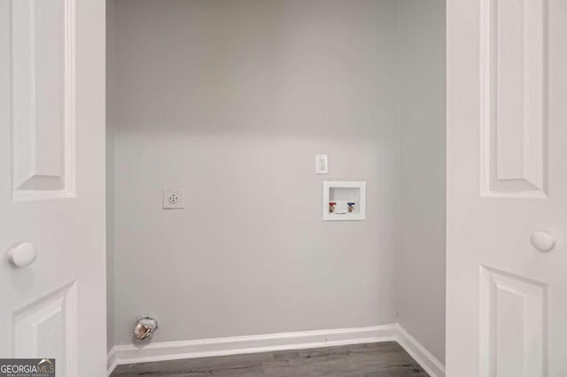 washroom featuring hookup for an electric dryer, hardwood / wood-style flooring, and washer hookup