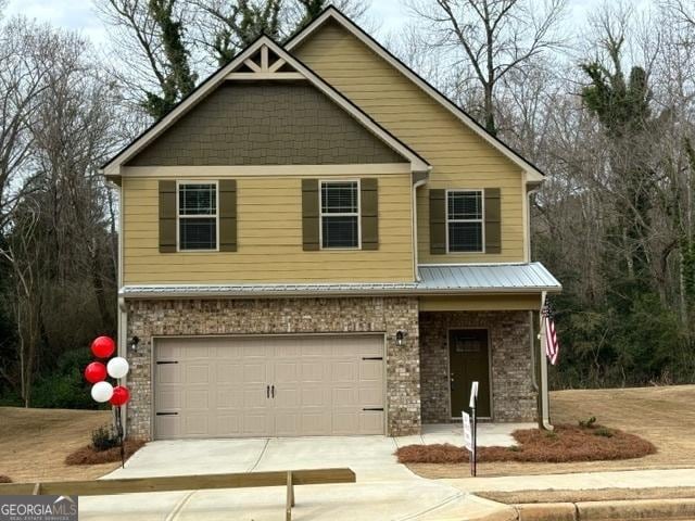 view of front of property featuring a garage