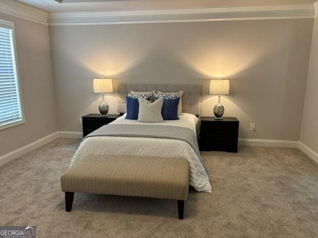 carpeted bedroom featuring crown molding