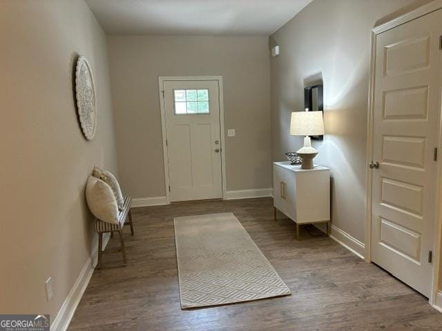 foyer entrance with light hardwood / wood-style floors