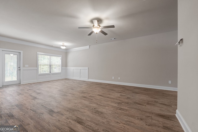 spare room with ceiling fan and dark hardwood / wood-style flooring