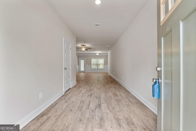 hallway with light wood-type flooring