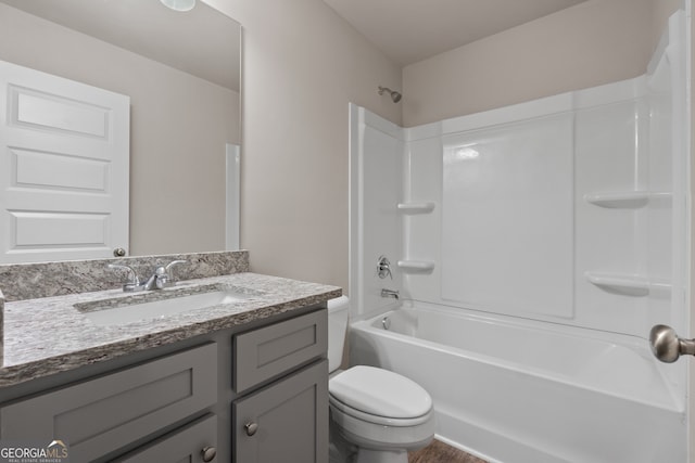 full bathroom featuring shower / washtub combination, toilet, and vanity