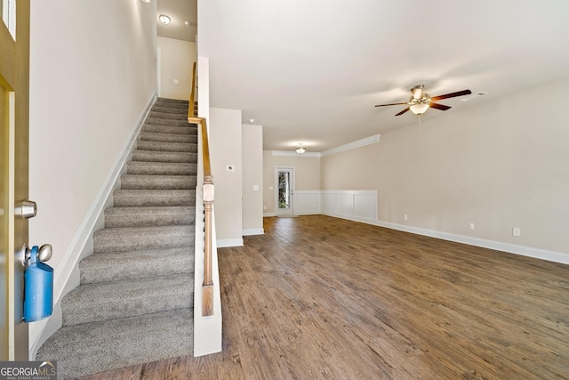 stairway featuring hardwood / wood-style floors and ceiling fan