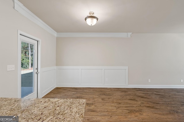 interior space featuring crown molding and dark hardwood / wood-style flooring