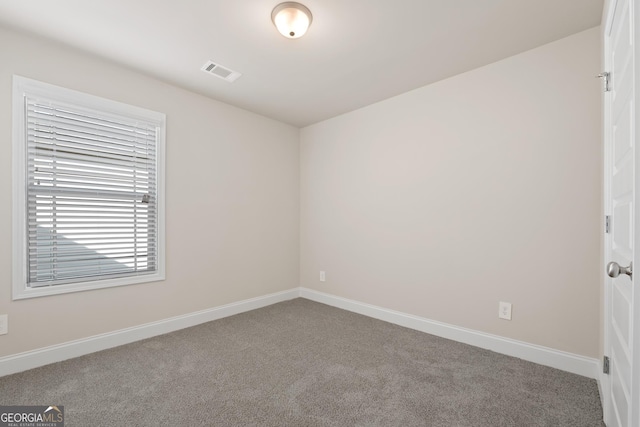 unfurnished room featuring carpet floors