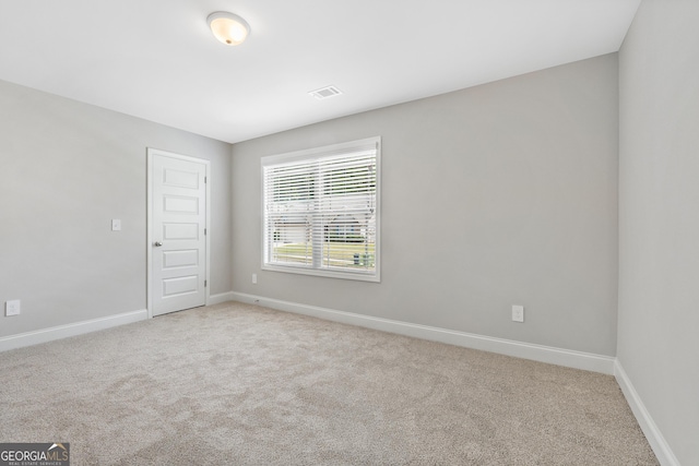 empty room featuring carpet floors