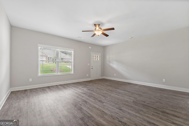 empty room featuring dark hardwood / wood-style floors and ceiling fan