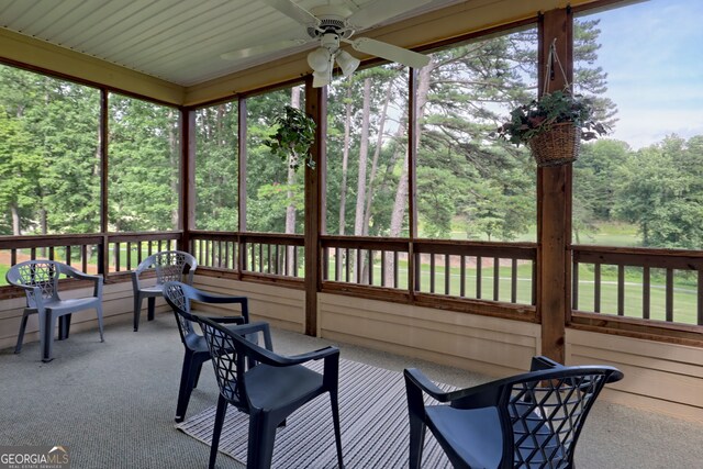 sunroom with a wealth of natural light and ceiling fan