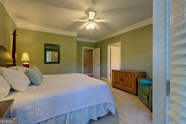 bedroom with light carpet, ceiling fan, and crown molding