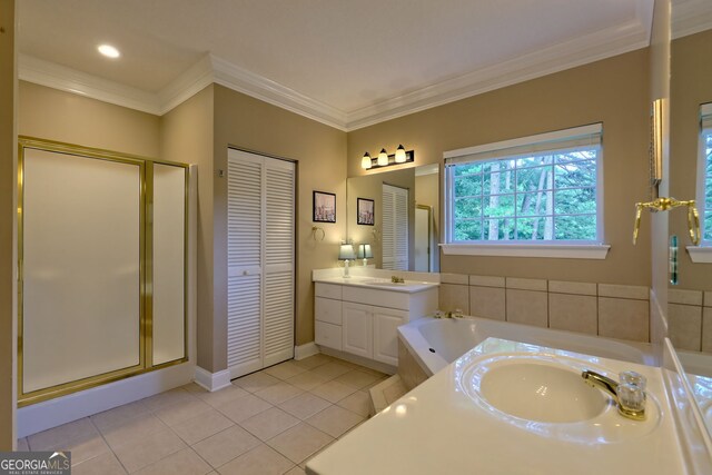 bathroom featuring tile patterned flooring, independent shower and bath, crown molding, and vanity