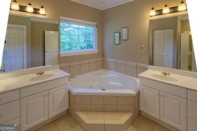 bathroom with tiled tub, vanity, tile patterned floors, and crown molding