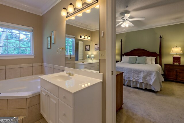 carpeted bedroom with ceiling fan, sink, and crown molding