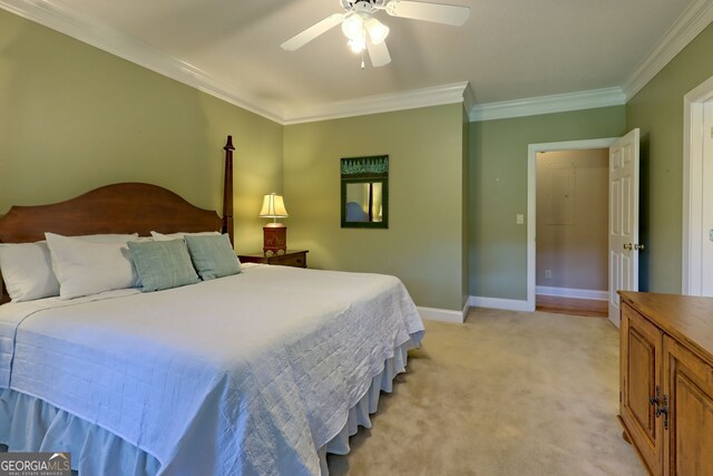 carpeted bedroom with crown molding and ceiling fan