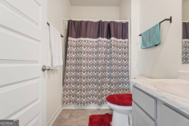 bathroom with vanity, a shower with curtain, and toilet