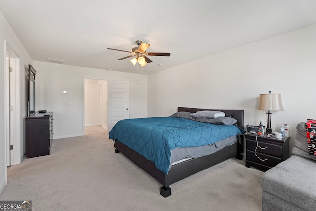 bedroom featuring light carpet and ceiling fan