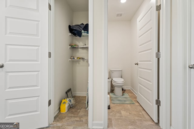 bathroom featuring toilet