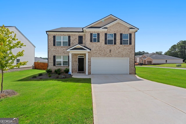 view of front facade with a garage and a front lawn