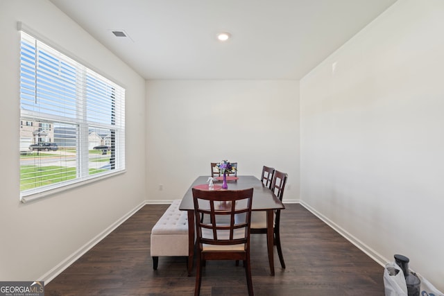 dining room with dark hardwood / wood-style flooring