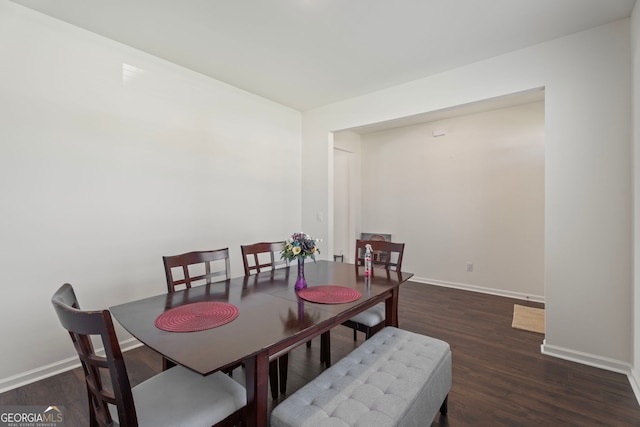 dining room with dark wood-type flooring