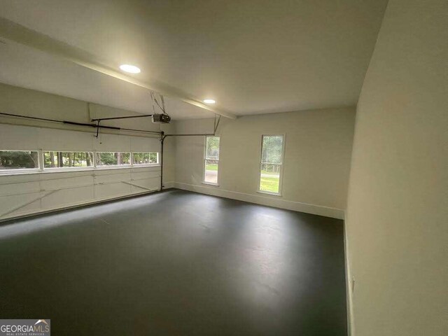 unfurnished room with concrete floors