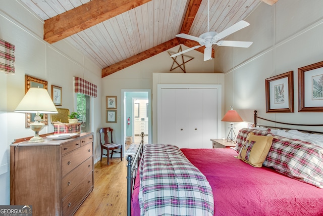 bedroom with ceiling fan, wooden ceiling, vaulted ceiling with beams, light hardwood / wood-style floors, and a closet