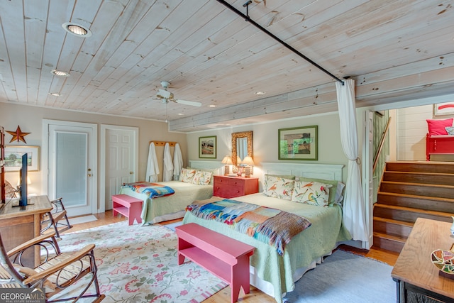 bedroom featuring ceiling fan, wooden ceiling, and light hardwood / wood-style flooring