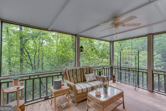 sunroom / solarium featuring ceiling fan and a healthy amount of sunlight