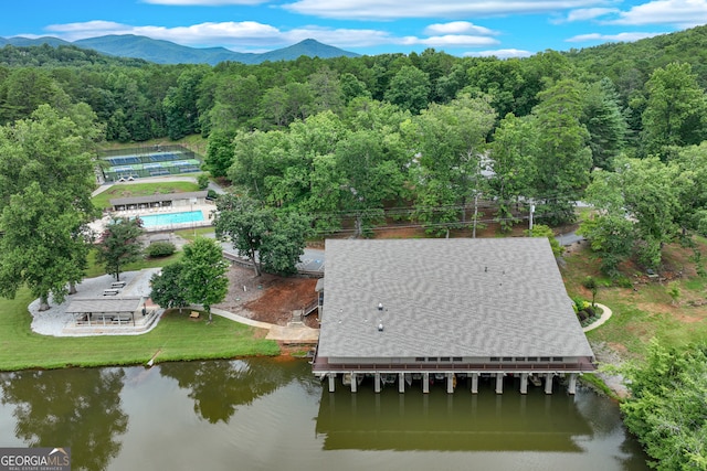 drone / aerial view with a water and mountain view