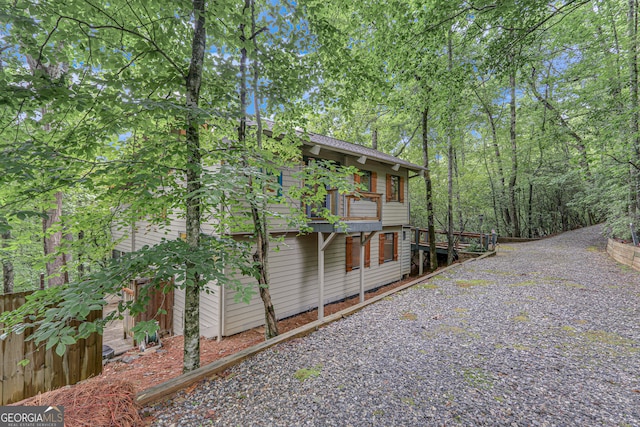 view of side of home with a deck