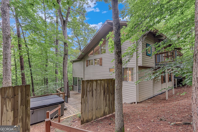 view of side of property featuring a jacuzzi