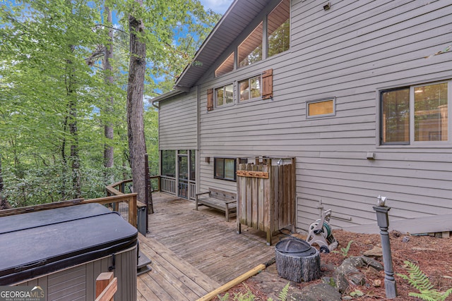 deck with a hot tub