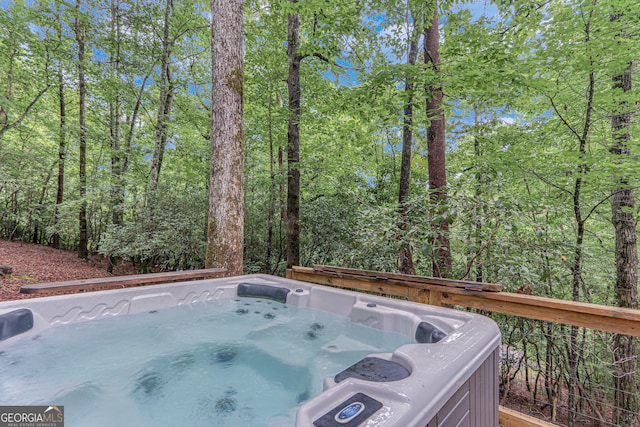 deck featuring a hot tub