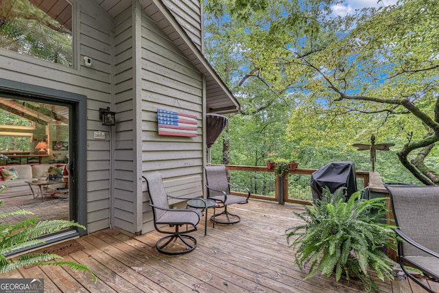 wooden terrace featuring grilling area