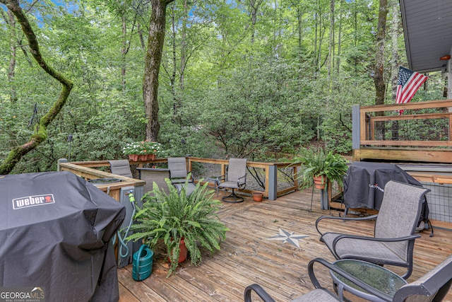 wooden deck with grilling area