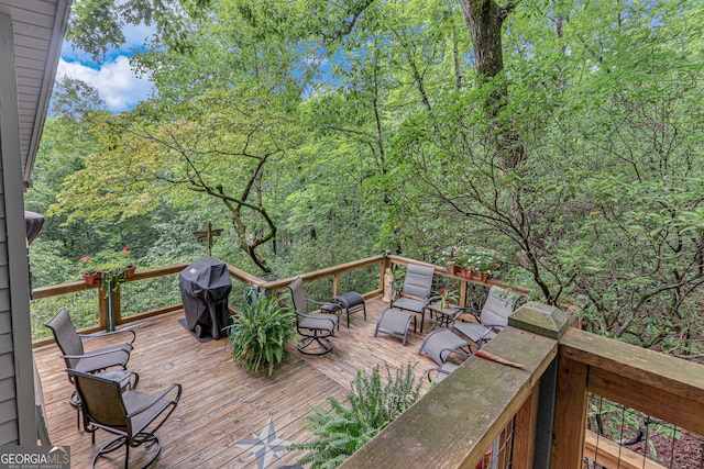 wooden terrace with area for grilling