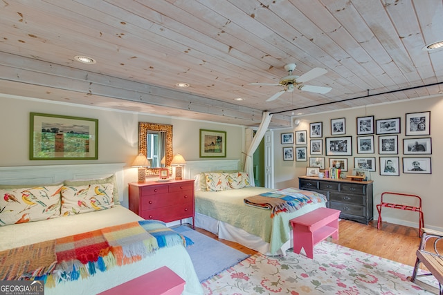 bedroom with light hardwood / wood-style floors, ceiling fan, and wooden ceiling