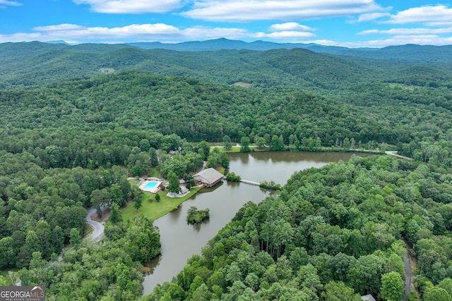 drone / aerial view with a water and mountain view