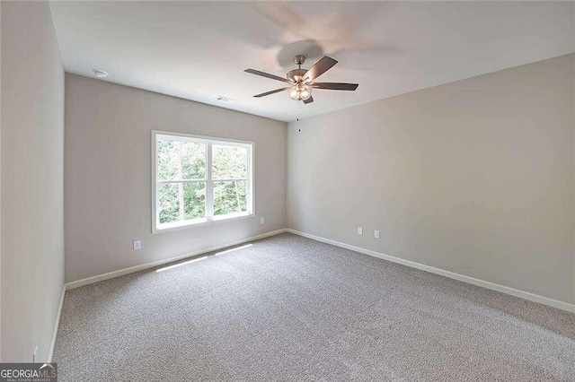 unfurnished room with carpet floors and ceiling fan