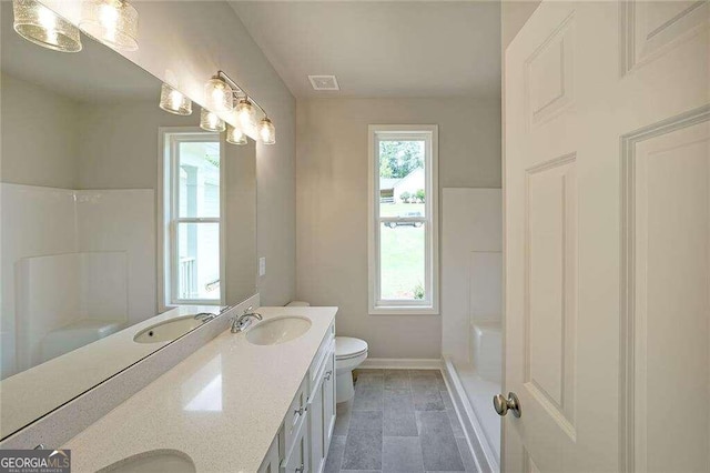 full bathroom with tile patterned floors, shower / bathing tub combination, double sink vanity, and toilet