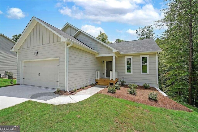 view of front of house with a garage and a front lawn