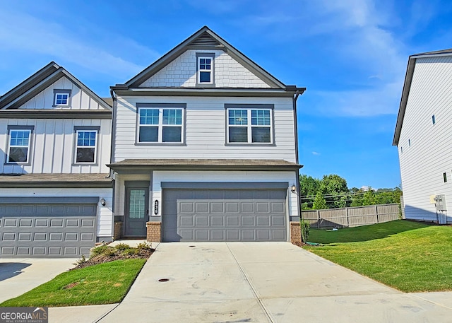 view of front facade featuring a front yard and a garage