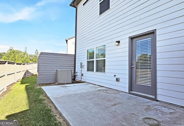 exterior space featuring central AC and fence private yard