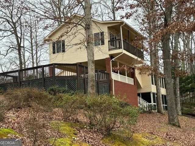 rear view of property with a balcony