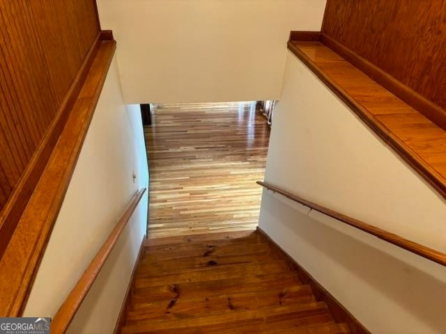 stairway featuring hardwood / wood-style flooring